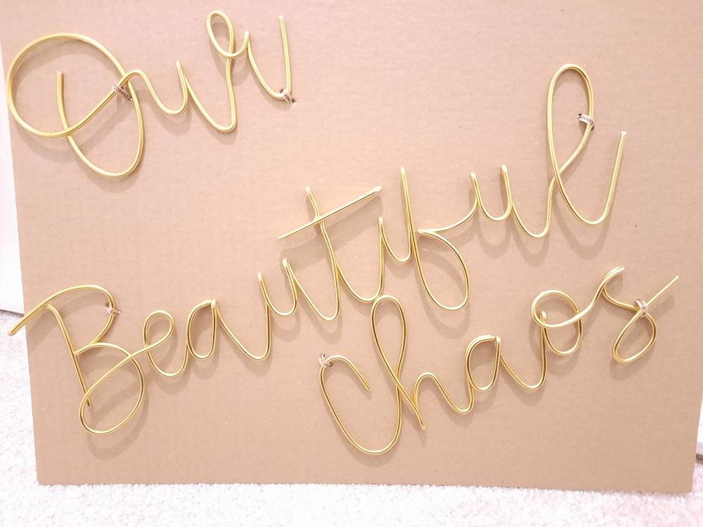 Wire Our Beautiful Chaos wall sign